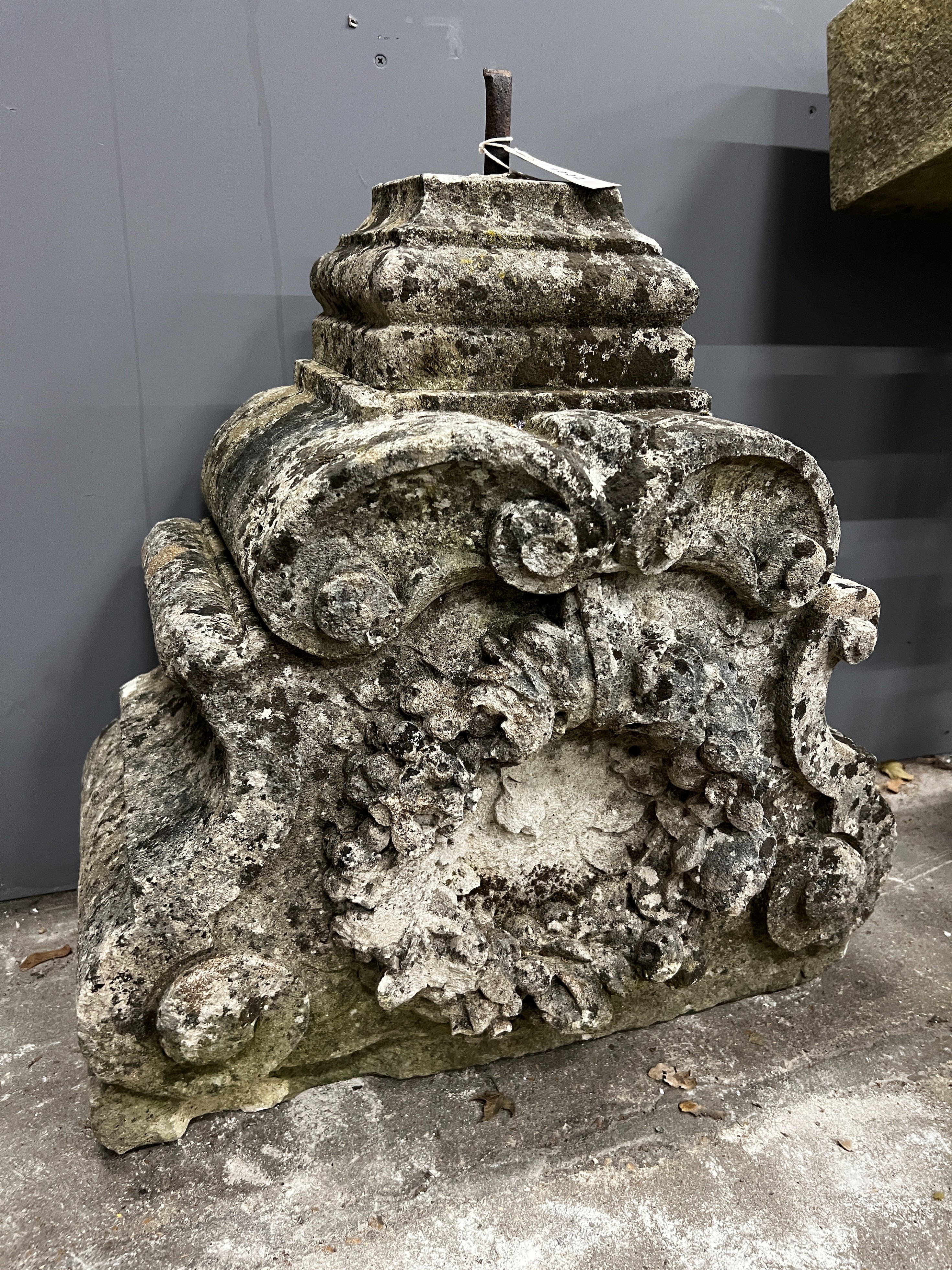 A carved stone corbel, width 60cm, height 60cm